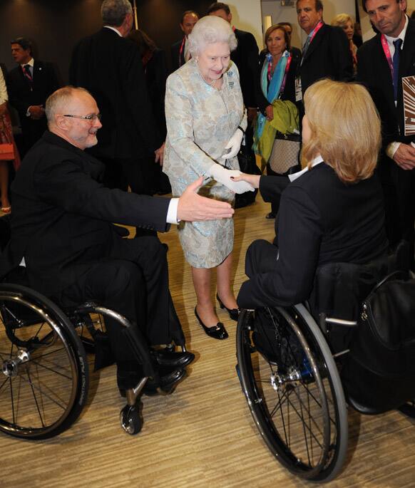 Britain's Queen Elizabeth II meets members of the International Paralympic Committee at a reception at the Olympic Stadium ahead of the opening ceremony for the London Paralympic Games 2012, in London.