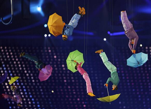 Performers with umbrellas are suspended in the air during the Opening Ceremony for the 2012 Paralympics in London.