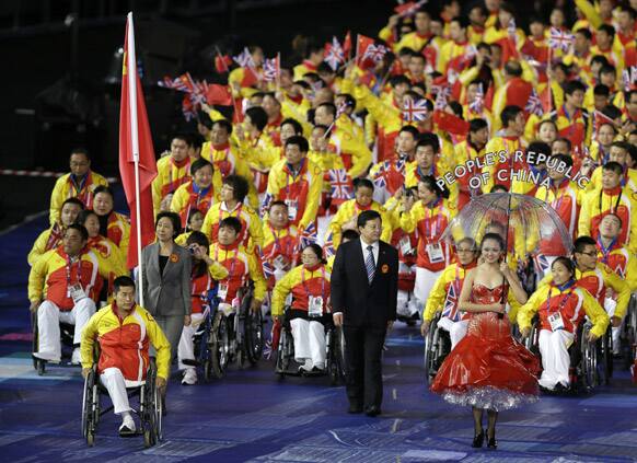 China's flagbearer wheelchair racer Zhang Lixin during the Opening Ceremony for the 2012 Paralympics in London.