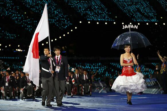 Japan's flagbearer swimmer Japan Keiichi Kimura during the Opening Ceremony for the 2012 Paralympics in London.