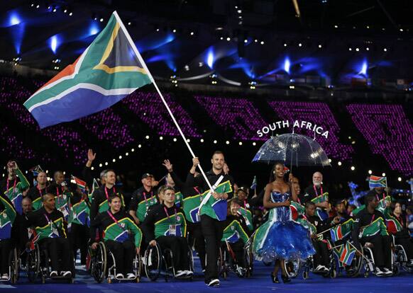 South Africa's flagbearer runner Oscar Pistorius leads his team during the Opening Ceremony for the 2012 Paralympics in London.