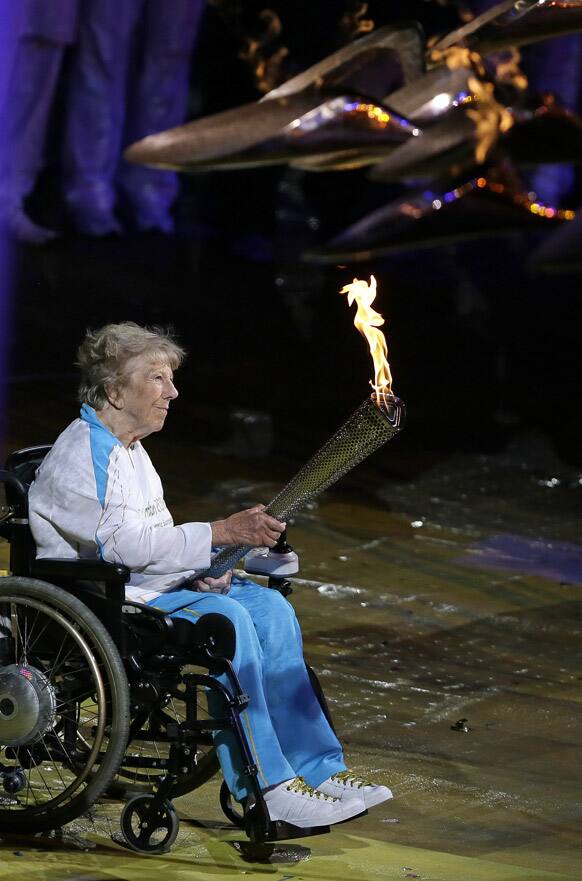 Margaret Maughan, Britain's first Paralympic gold medalist, lights the Paralympic flame during the Opening Ceremony for the 2012 Paralympics in London.