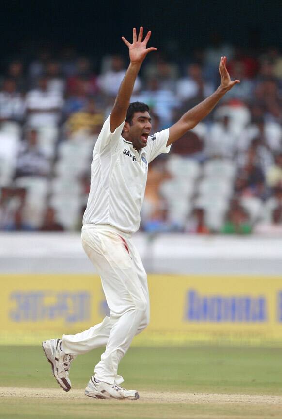 Ravichandran Ashwin celebrates a New Zealand wicket during the fourth day of their first cricket test match in Hyderabad.