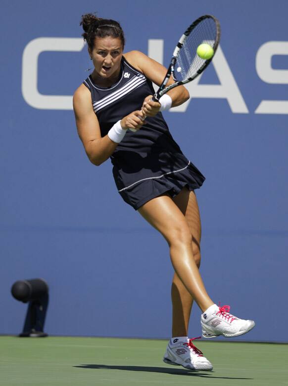 Spain's Lara Arruabarrena-Vecino returns a shot to Serbia's Jelena Jankovic in the second round of play at the 2012 US Open tennis tournament.