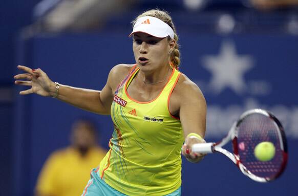 Angelique Kerber, of Germany, returns a shot to Venus Williams during a match at the US Open tennis tournament.