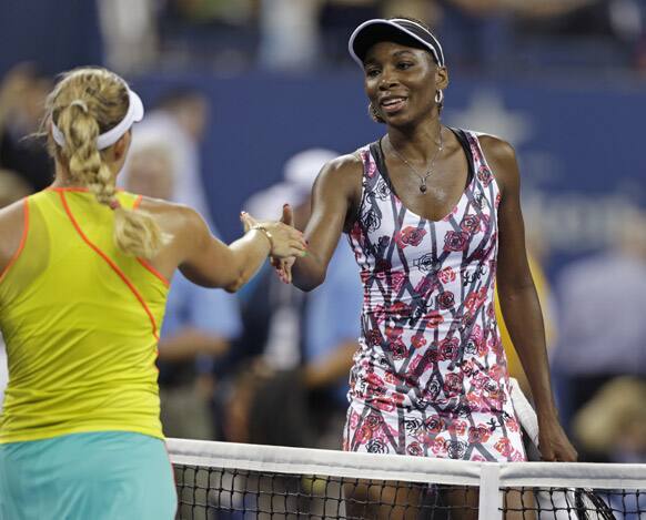 Venus Williams shakes hands with Angelique Kerber, of Germany, after her 6-2, 5-7, 7-5 loss in the second round of play at the 2012 US Open tennis tournament in New York.