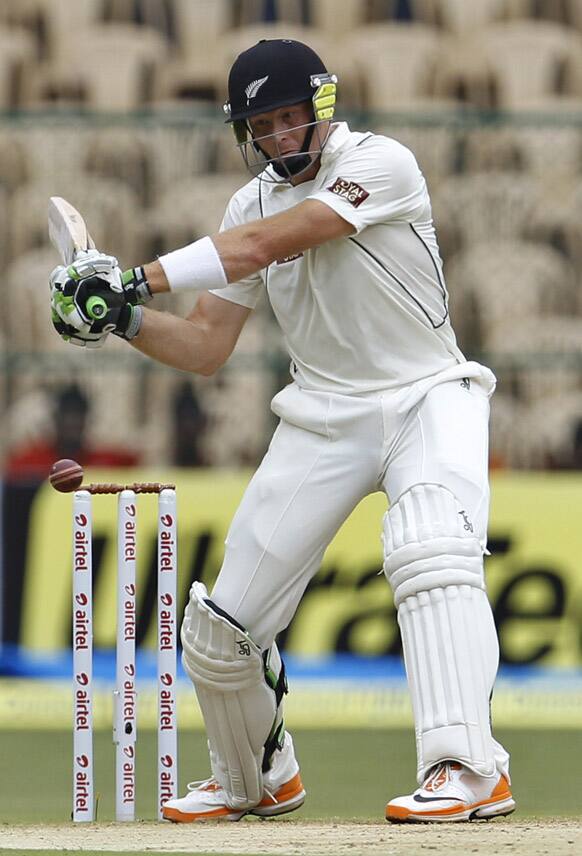 Martin Guptill prepares to play a shot during the first day of their second cricket test match against India in Bangalore.