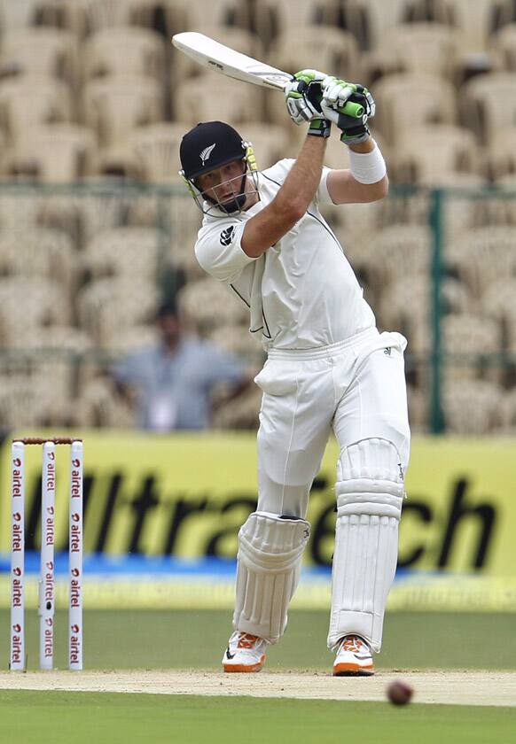 Martin Guptill plays a shot during the first day of their second cricket test match against India in Bangalore.