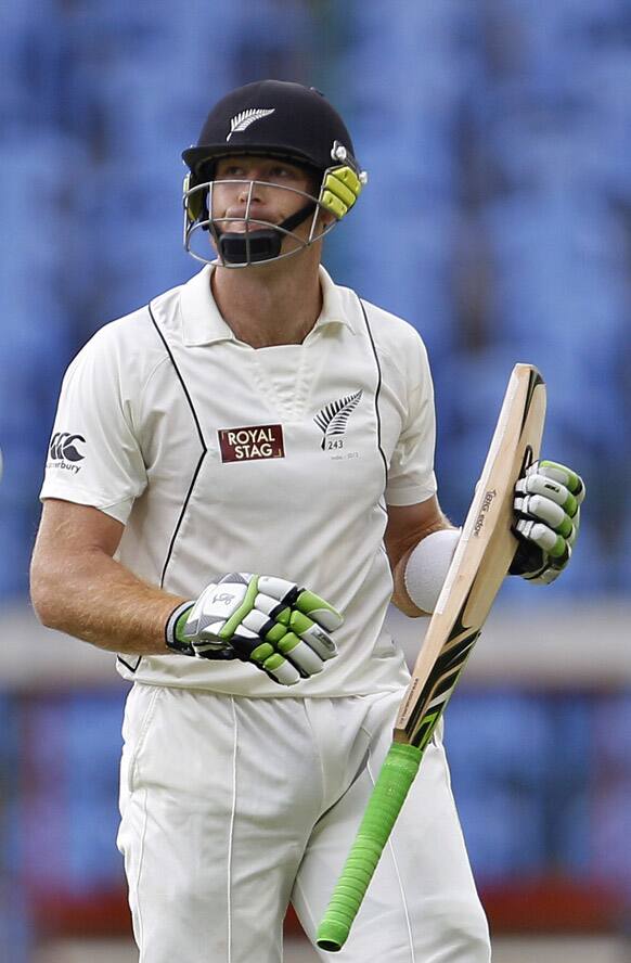 Martin Guptill reacts as he leaves the ground after losing his wicket during the first day of their second cricket test match against India in Bangalore.