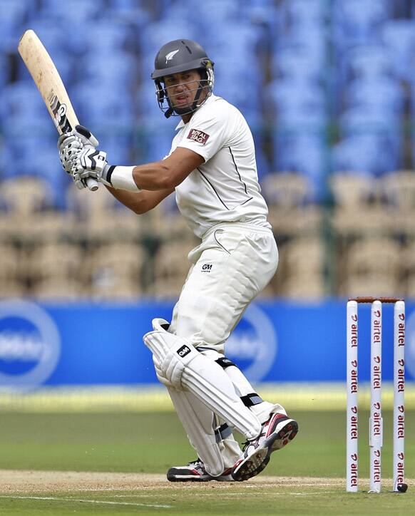 Ross Taylor watches his shot during the first day of their second cricket test match against India in Bangalore.