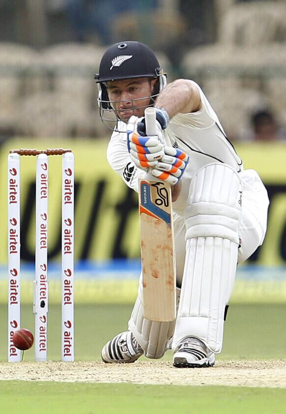 Kruger van Wyk plays a shot during the first day of their second cricket test match against India in Bangalore.