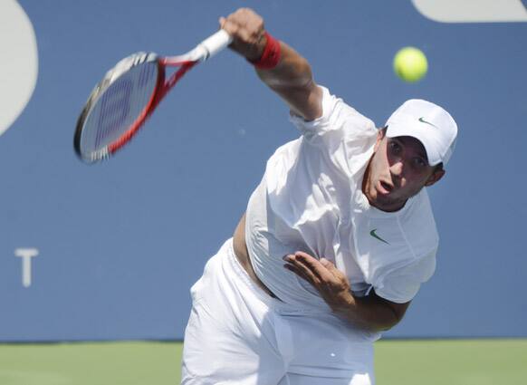 Igor Sijsling, of the Netherlands, serves to Spain's David Ferrer in the third round of play at the 2012 US Open tennis tournament, in New York. 