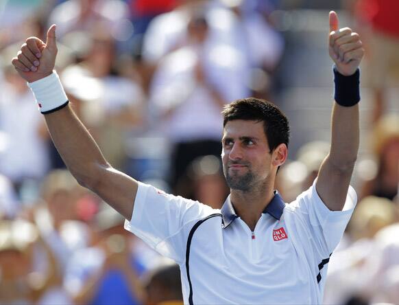 Novak Djokovic of Serbia celebrates winning his match against Brazil's Rogerio Dutra Silva in the third round of play at the 2012 US Open tennis tournament, in New York.