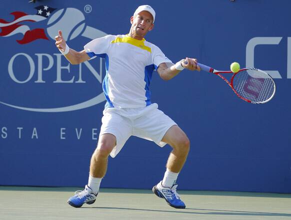 Jarkko Nieminen, of Finland, returns a shot to Josh Isner in the third round of play at the 2012 US Open tennis tournament, in New York.