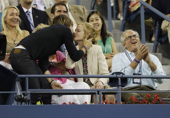 Keith Urban, kisses Nicole Kidman during a match between Andy Roddick and Australia's Bernard Tomic in the third round of play at the 2012 US Open tennis tournament, in New York. 