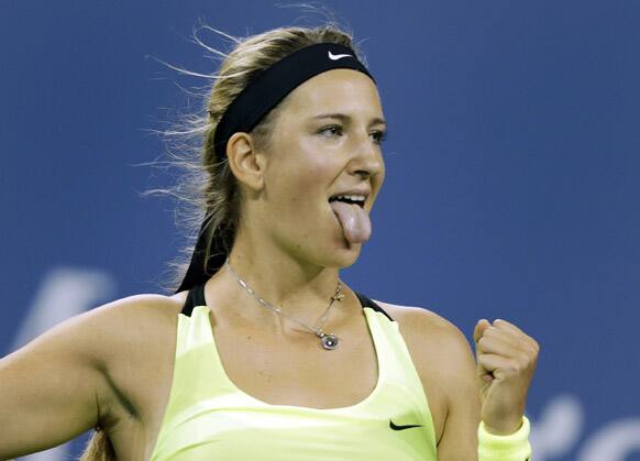 Victoria Azarenka, of Belarus, celebrates her 6-0, 6-1, win over Zheng Jie, of China, in the third round of play at the U.S. Open tennis tournament, in New York.