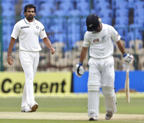 Zaheer Khan, left, reacts after taking the wicket of New Zealand batsman Kruger van Wyk, right, during the second day of their second cricket test match in Bangalore.