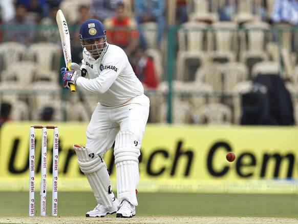 Virender Sehwag prepares to play a shot during the second day of their second cricket test match against New Zealand in Bangalore.