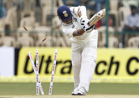 Sachin Tendulkar is bowled out by New Zealand bowler Doug Bracewell during the second day of their second cricket test match in Bangalore.