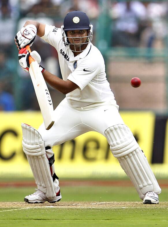 Suresh Raina plays a shot during the second day of the second cricket test match against New Zealand in Bangalore.