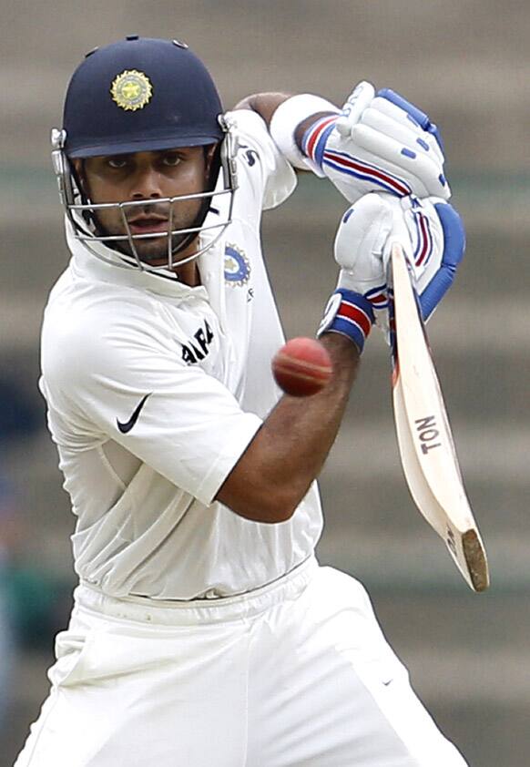 Virat Kohli plays a shot during the second day of the second cricket test match against New Zealand in Bangalore.