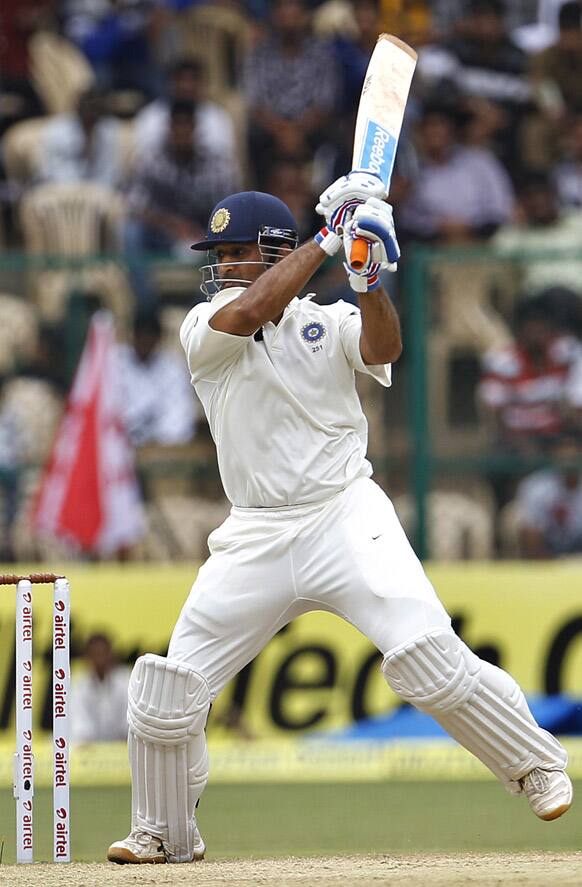 Mahendra Singh Dhoni bats during the second day of the second cricket test match against New Zealand in Bangalore.