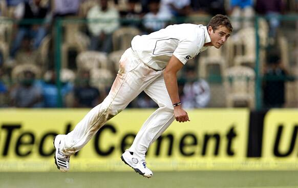 New Zealand bowler Tim Southee bowls during the second day of their second cricket test match against India in Bangalore.