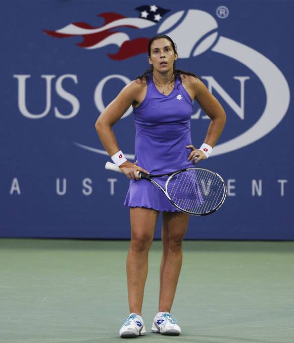 Marion Bartoli, of France, reacts during a match against Petra Kvitova, of the Czech Republic, in the fourth round of play at the 2012 US Open tennis tournament.