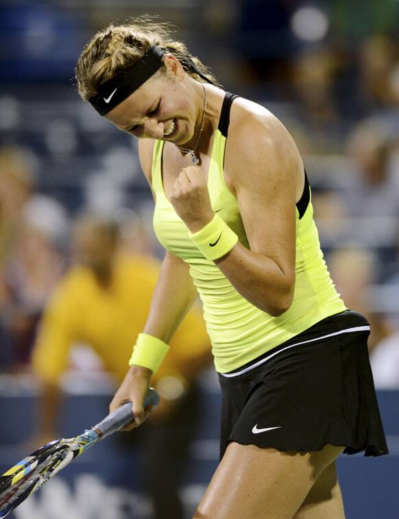 Victoria Azarenka, of Belarus, celebrates her 6-2, 6-2 win over Anna Tatishvili, of Georgia, in the fourth round of play at the US Open tennis tournament.