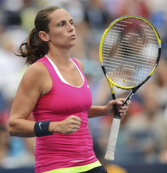 Italy's Roberta Vinci reacts during her match against Poland's Agnieszka Radwanska in the fourth round of play at the 2012 US Open tennis tournament.