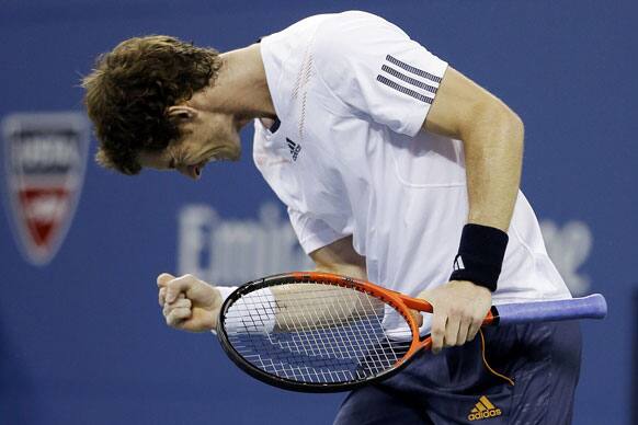 Andy Murray, of Britain, reacts after breaking the serve of Milos Raonic, of Canada, during a match at the US Open tennis tournament.