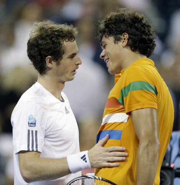 Andy Murray, left, of Britain, is congratulated by Milos Raonic, of Canada, after Murray defeated Raonic in a match during the U.S. Open tennis tournament in New York. Murray won 6-4, 6-4, 6-2.