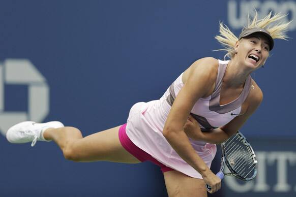 Maria Sharapova, of Russia, returns a shot to Marion Bartoli, of France, in the quarterfinals of the 2012 US Open tennis tournament in New York. 