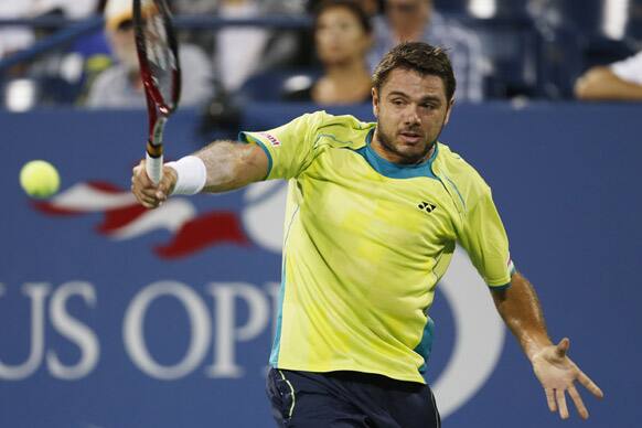 Switzerland's Stanislas Wawrinka returns a shot to Serbia's Novak Djokovic in the fourth round of play at the 2012 US Open tennis tournament in New York.