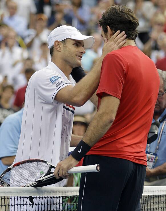 Andy Roddick, left, greets Argentina's Juan Martin Del Potro after their match in the quarterfinals during the 2012 US Open tennis tournament in New York. Roddick, who lost to Del Potro, said he would retire after the match.