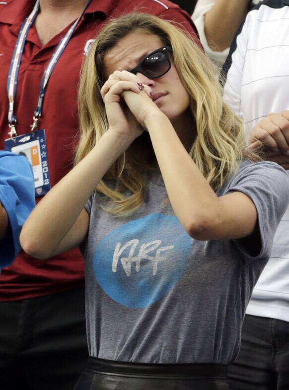 Brooklyn Decker, wife of Andy Roddick, reacts after Roddick lost his fourth round match to Argentina's Juan Martin Del Potro at the 2012 US Open tennis tournament.