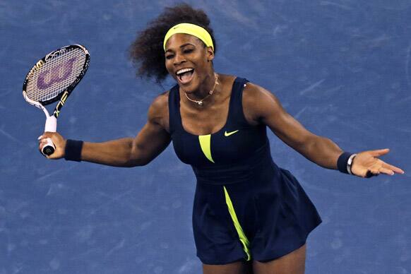 Serena Williams reacts at the net after missing a return against Ana Ivanovic, of Serbia, during the quarterfinal round of play at the U.S. Open tennis tournament.