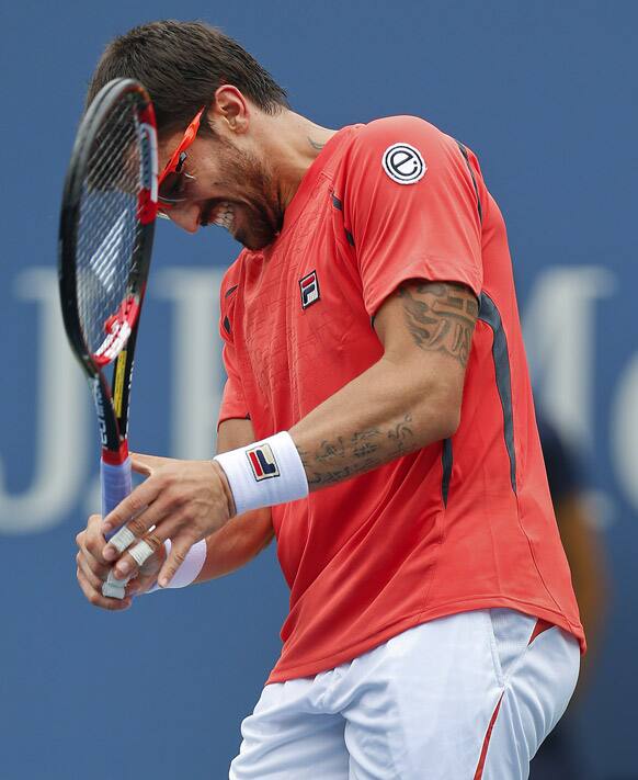 Janko Tipsarevic of Serbia reacts after losing a point to Spain's David Ferrer in the quarterfinals during the 2012 US Open tennis tournament.