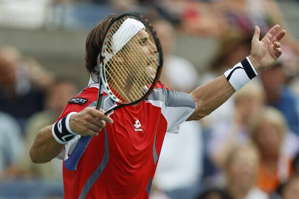 Spain's David Ferrer reacts while playing Serbia's Janko Tipsarevic in the quarterfinals during the 2012 US Open tennis tournament.