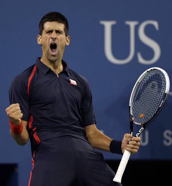 Novak Djokovic, of Serbia, reacts after winning a point in the second game against Juan Martin del Potro, of Argentina, in the quarterfinal round of play at the U.S. Open tennis tournament.