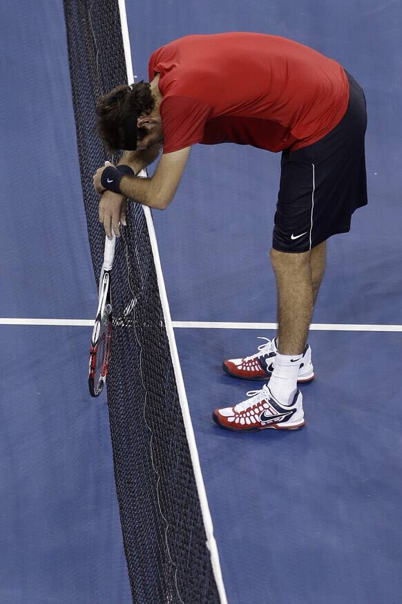 Juan Martin del Potro, of Argentina, reacts after missing a shot against Novak Djokovic, of Serbia, during a quarterfinals match at the U.S. Open tennis tournament.