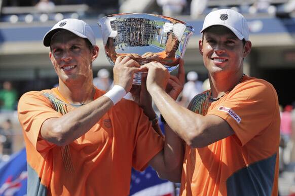 Mike, and Bob Bryan Bob Bryan pose with the trophy after winning their men's doubles final against India's Leander Paes and Czech Republic's Radek Stepanek at the 2012 US Open tennis tournament.