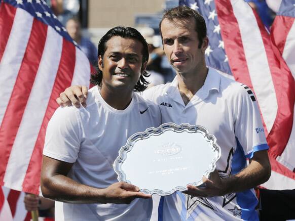 Leander Paes, and Radek Stepanek, of the Czech Republic, pose with the runner-up trophy after losing the men's doubles final of the 2012 US Open tennis tournament,  in New York.