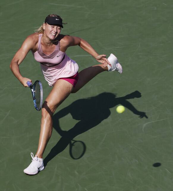 Maria Sharapova, of Russia, returns a shot to Victoria Azarenka, of Belarus,during a semifinal match at the 2012 US Open tennis tournament.