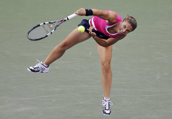 Italy's Sara Errani serves to Serena Williams during a semifinal match at the 2012 US Open tennis tournament.