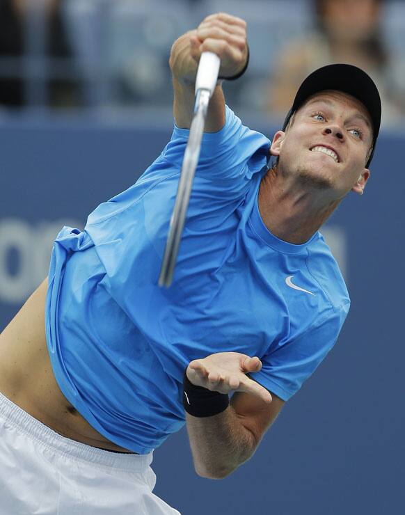 Czech Republic's Tomas Berdych serves to Britain's Andy Murray during a semifinal match at the 2012 US Open tennis tournament.