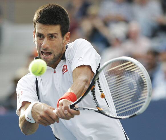 Serbia's Novak Djokovic returns a shot to Spain's David Ferrer during a semifinal match at the 2012 US Open tennis tournament.