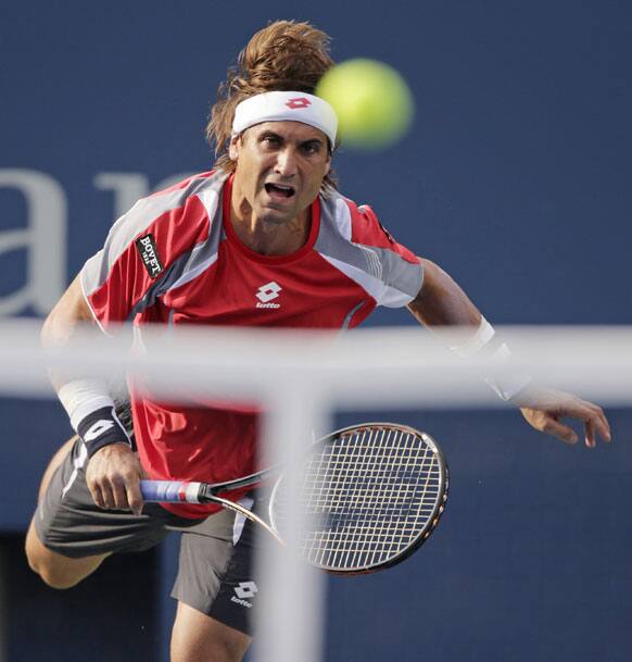 Spain's David Ferrer returns a shot to Serbia's Novak Djokovic during a semifinal match at the 2012 US Open tennis tournament.