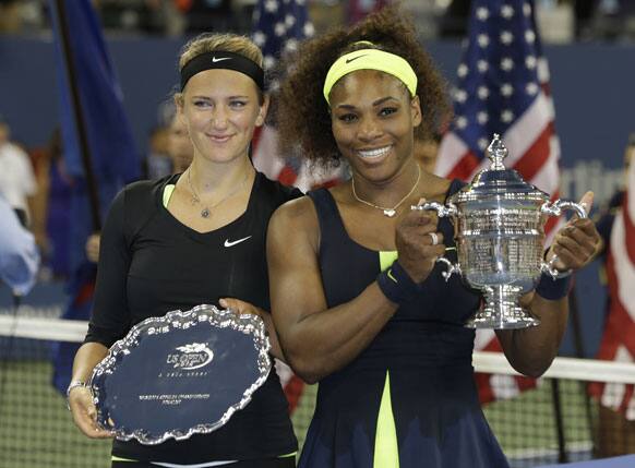 Victoria Azarenka of Belarus and Serena Williams pose with their trophies after the championship match at the 2012 US Open tennis tournament.