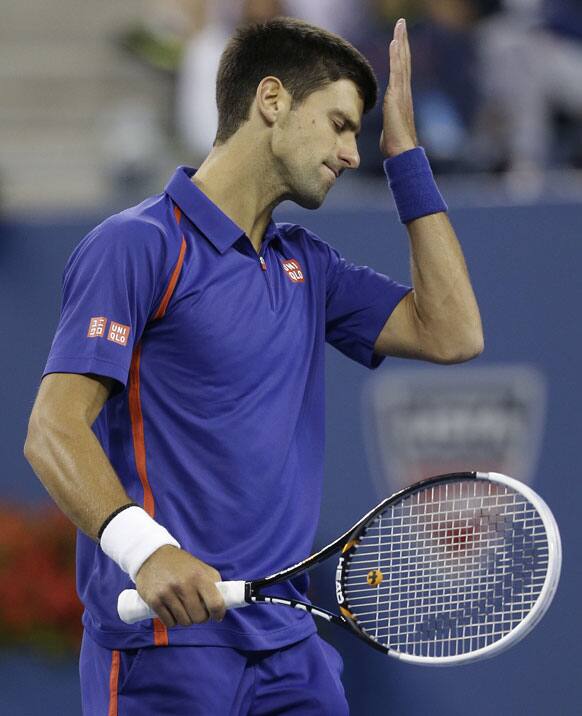 Serbia's Novak Djokovic reacts while playing against Britain's Andy Murray in the championship match at the 2012 US Open tennis tournament.